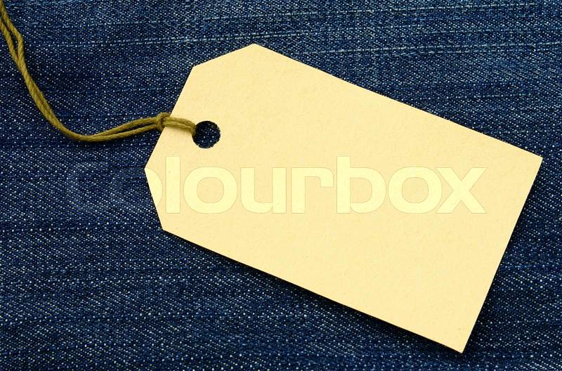 Label for goods estimation on a jeans fabric, stock photo