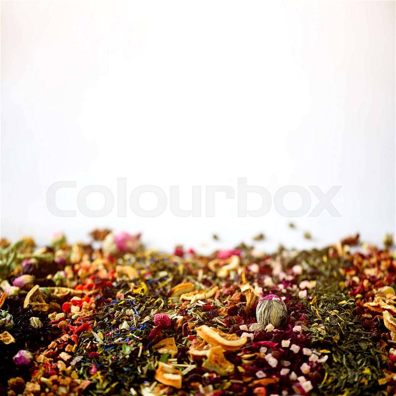 Different types of tea: green, black, floral, herbal, mint, melissa, rose, hibiscus, cornflower. Dry tea assortment with organic fruits, berries, ginger, orange, raspberry, cranberry. Top view, stock photo