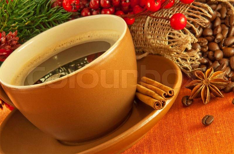 Christmas branch from berries and a fur-tree and a cup of coffee, stock photo