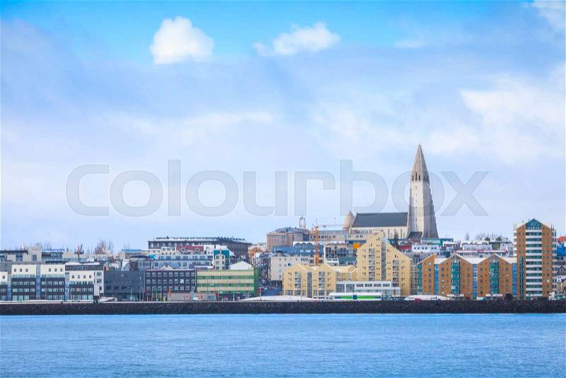 Modern buildings and Hallgrimskirkja cathedral. Coastal skyline of Reykjavik, capital city of Iceland, stock photo