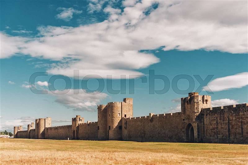 Famous fortification wall surrounding Aigues-Mortes city, Camargue, France, stock photo