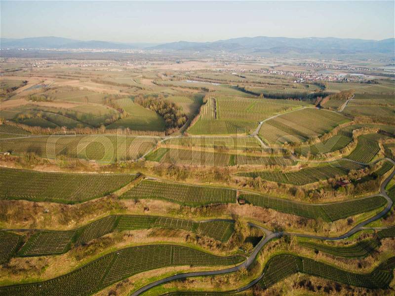 Aerial view of landscape with green fields on tiers, Germany, stock photo