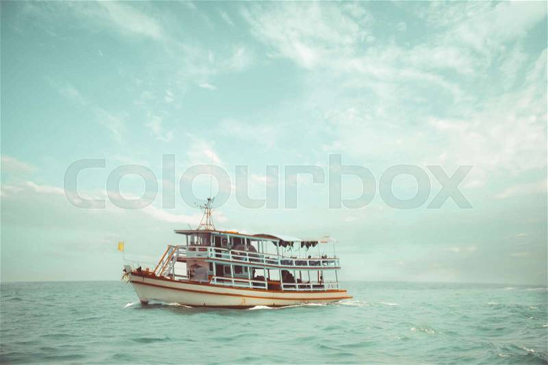 Old passenger ships floating in the ocean. boat of adventure and journey floating in sea in summer. vintage color tone, stock photo