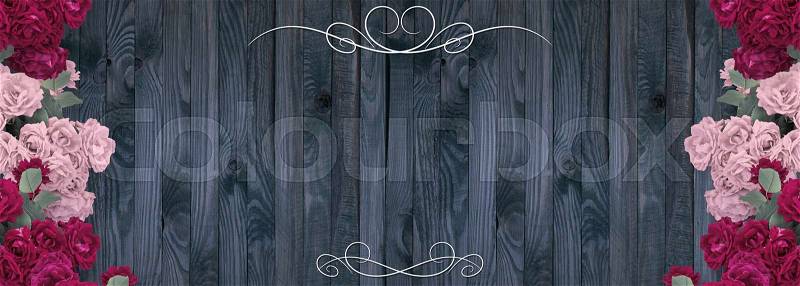 Roses, ornament and place for your text on background of shabby wooden planks in rustic style. Copy space, stock photo