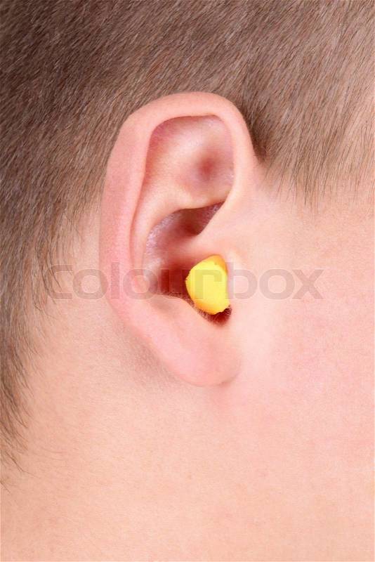 Yellow ear plug, stock photo