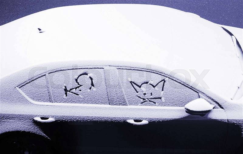 Blue color toned chromacity of abovecar covered with snow and cartoon faces of a mice and a cat - children draw , stock photo