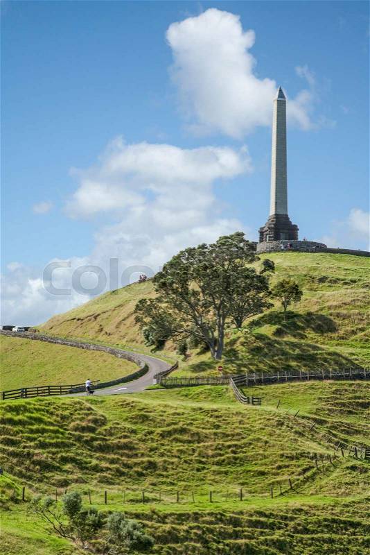 Famous Auckland landmark, One Tree Hill on a beautiful summer afternoon, stock photo