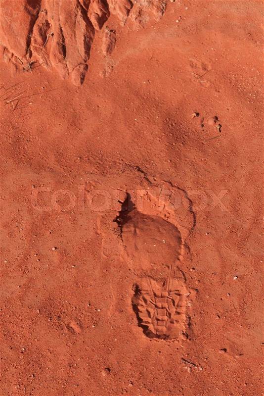Imprint of the shoe on red stone sand in Valley of Fire, Nevada, USA, stock photo