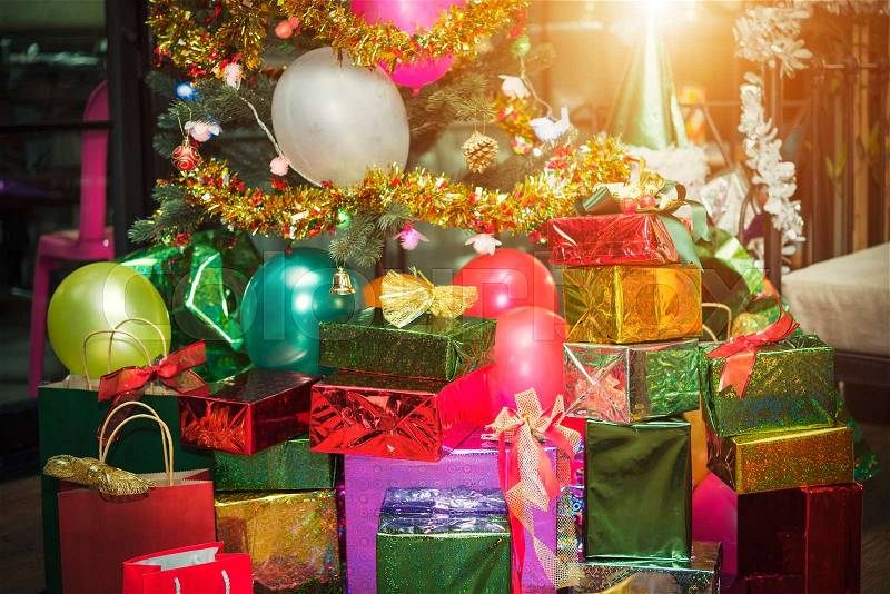 Christmas gift giving concept. Many present boxs with ribbons in party room. Celebrate party background, stock photo