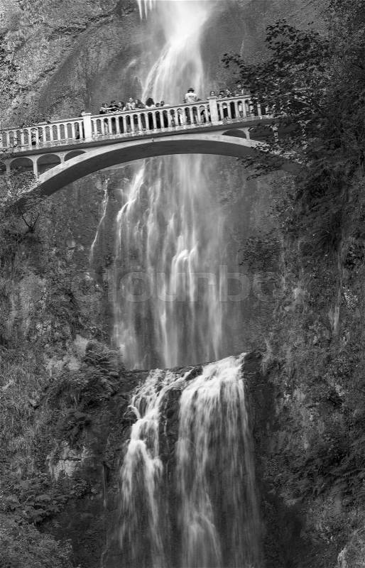 OREGON, US - AUGUST 19, 2017: Tourists visit Multnomah falls. This is a famous attraction along Columbia river gorge., stock photo