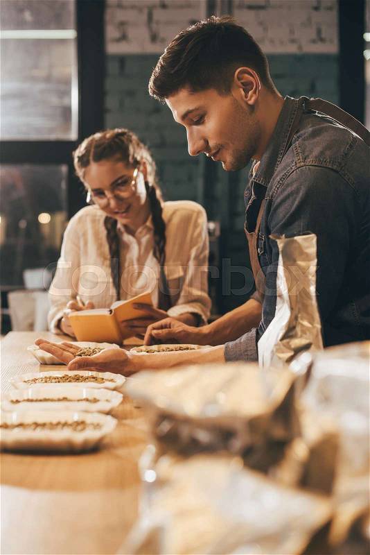 Selective focus of coffee shop workers checking coffee quality during coffee food function, stock photo