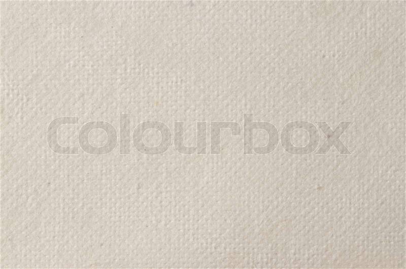 Cream textured paper closeup, can be used as a background, stock photo
