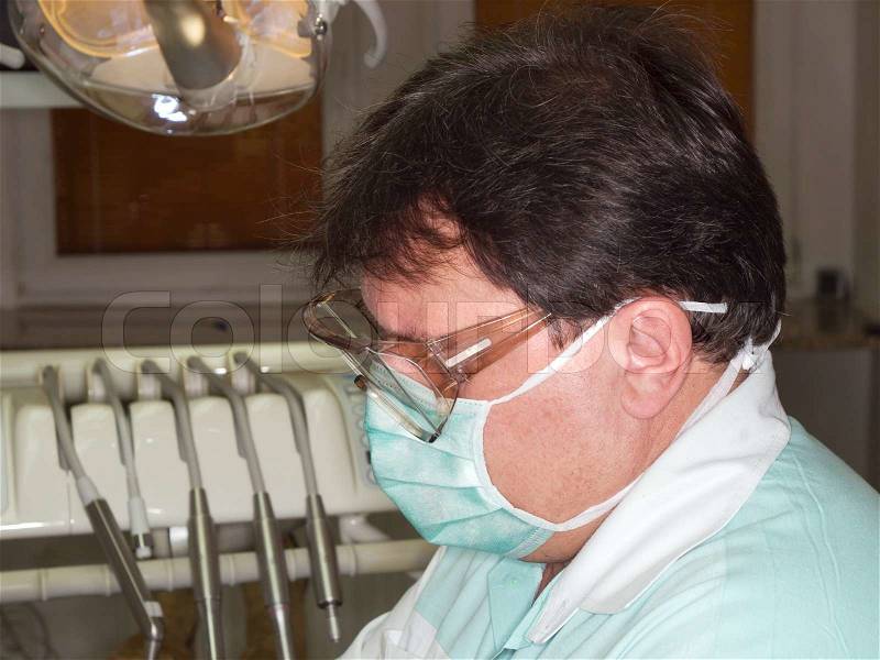 Dentist working with mask and glasess, stock photo
