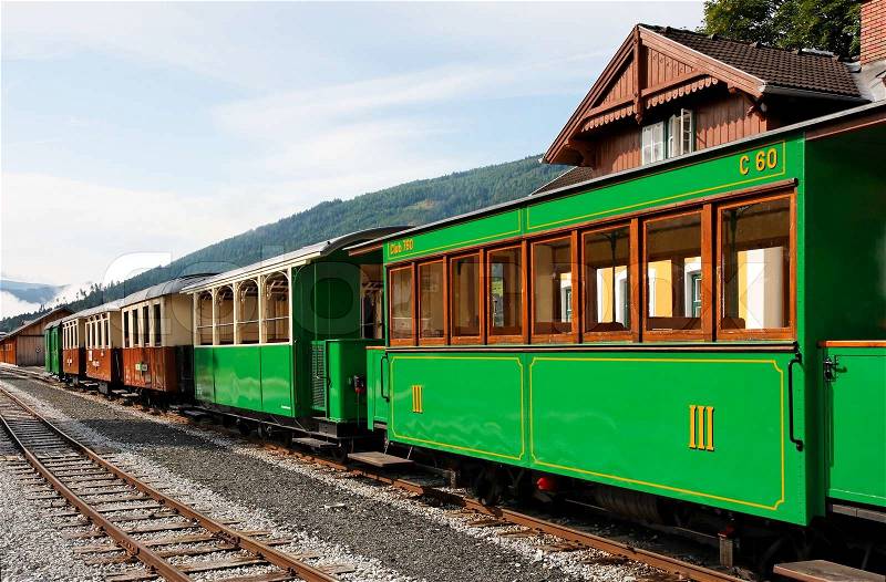 Historical railroad cars at train station in Mauterndorf village, Austria, stock photo