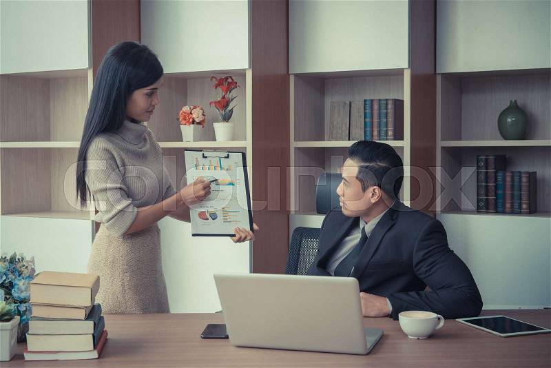 Businessman boss leader coaching and teaching secretary on the job training in office. Business and Education concept, stock photo