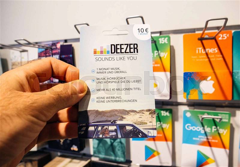 FRANKFURT, GERMANY - OCT 6, 2017: 50 Euro card in man hand point of view customer shopping for prepaid Deezer Music Gift card online money prepaid cards online music ..., stock photo