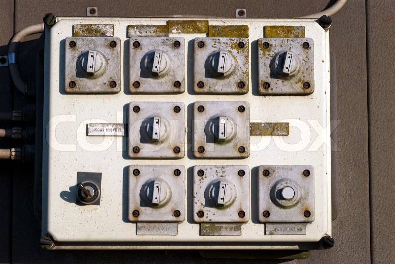 Closeup vintage outdoors electric switch panel in the sun, stock photo