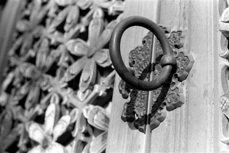 Ornate Door Handle to A Temple w/ Wood Carved Flowers, stock photo