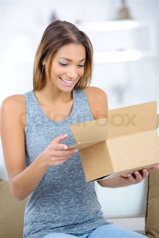 Beautiful woman dreaming about presents and surprises, stock photo