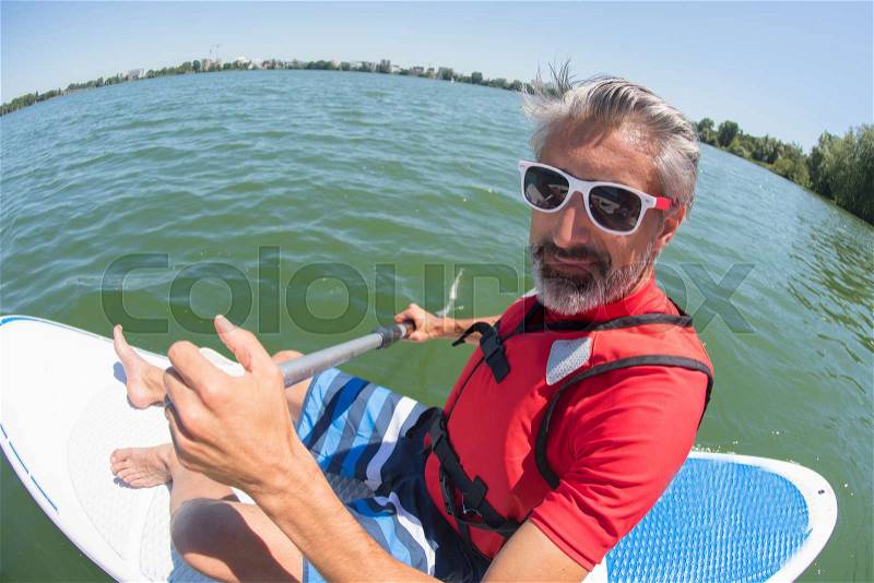 Man taking a break from stressing city life, stock photo