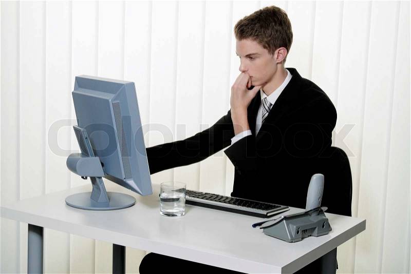 A man has problems with computer viruses and spam in the office, stock photo