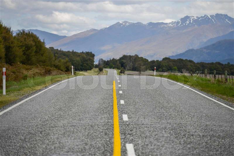 Highway road to mountains in New Zealand, stock photo