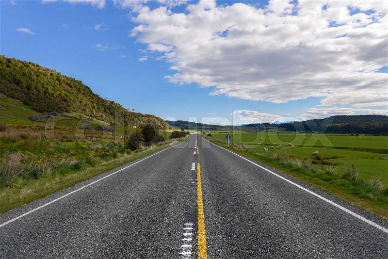 Straight Highway road in countryside New Zealand, stock photo
