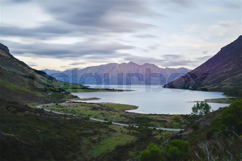 Lake Hawea in the middle of the valley in the evening at New Zealand Southland, stock photo