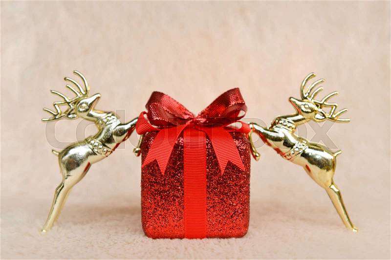Red Christmas gift box and gold horse, stock photo