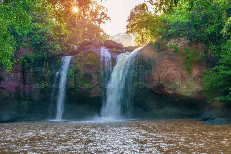 Beautiful waterfall with sunlight in jungle, Haew Suwat Waterfall, stock photo