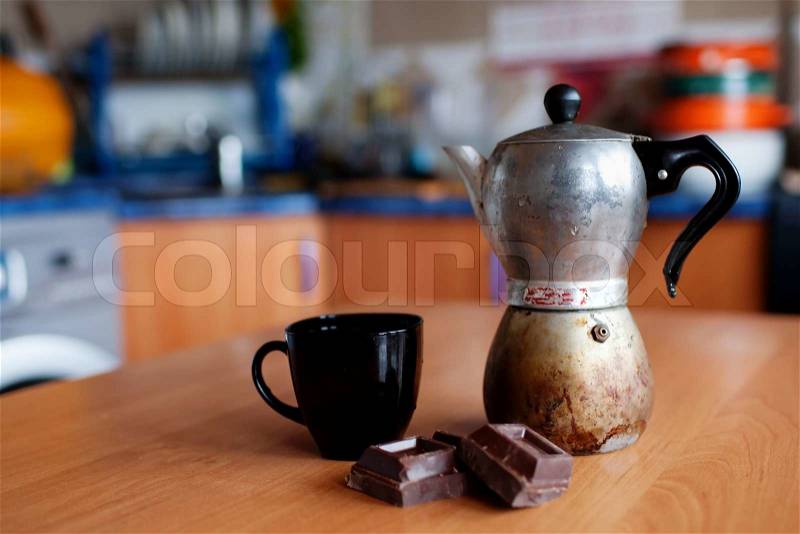 An image of coffee maker with cup and chokolate, stock photo