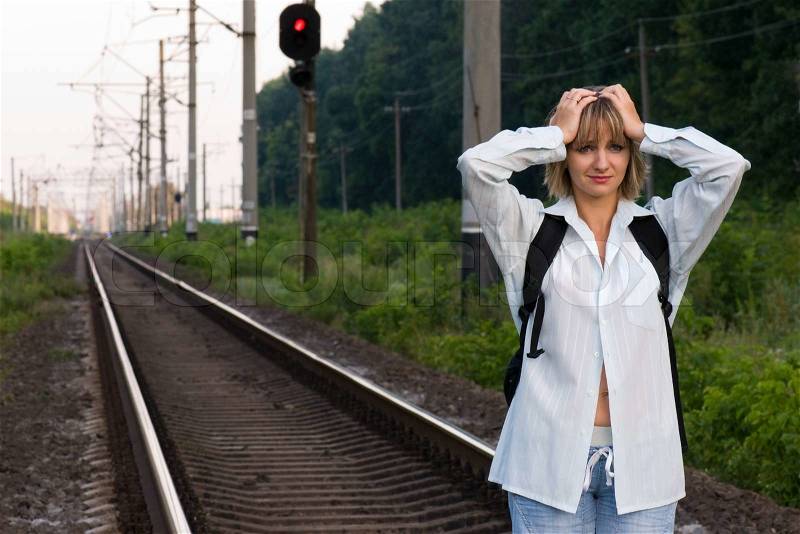The beautiful young woman, was late for a train, stock photo