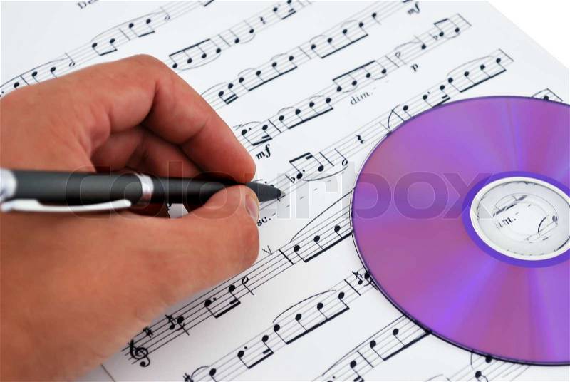Cd or dvd drive, musical notes and hand make notes, stock photo