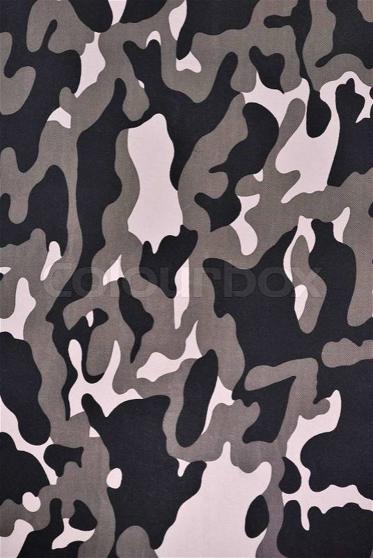Close up camouflage fabric in a vertical orientation, stock photo