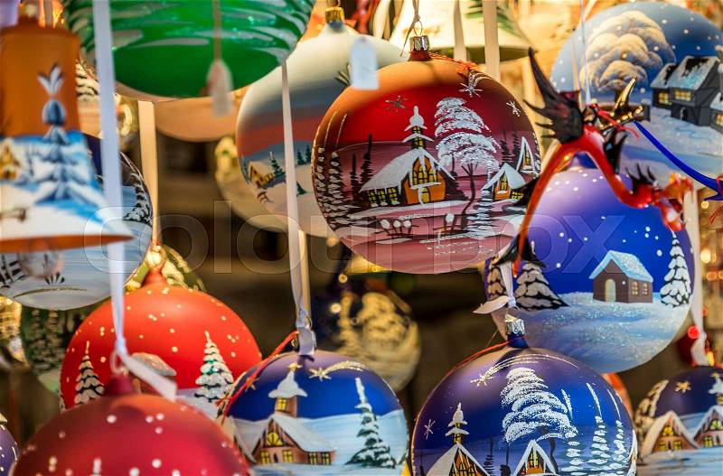 Hand-painted Christmas tree balls at a booth at the Christmas market in Braunschweig, Germany, close-up view, stock photo