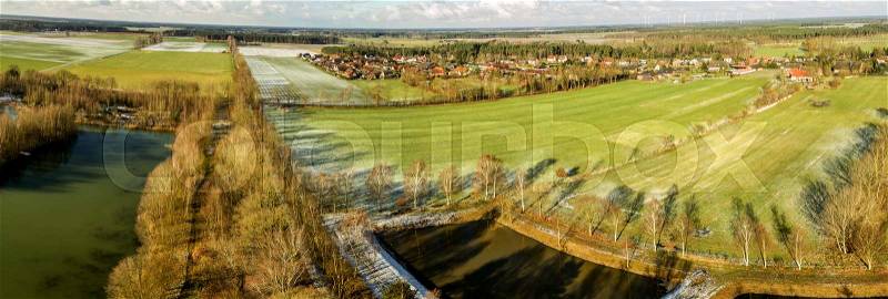Aerial landscape photo, aerial photo with a lake, fields, meadows, forests and a road, panorama as a banner for a blog or a website, drone landscape photo, stock photo