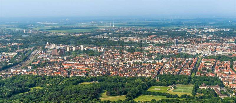 Aerial view of the southern edge of the city of Braunschweig, with parts of the railway station, residential buildings with detached houses, terraced houses and high-rise buildings, airplane, stock photo