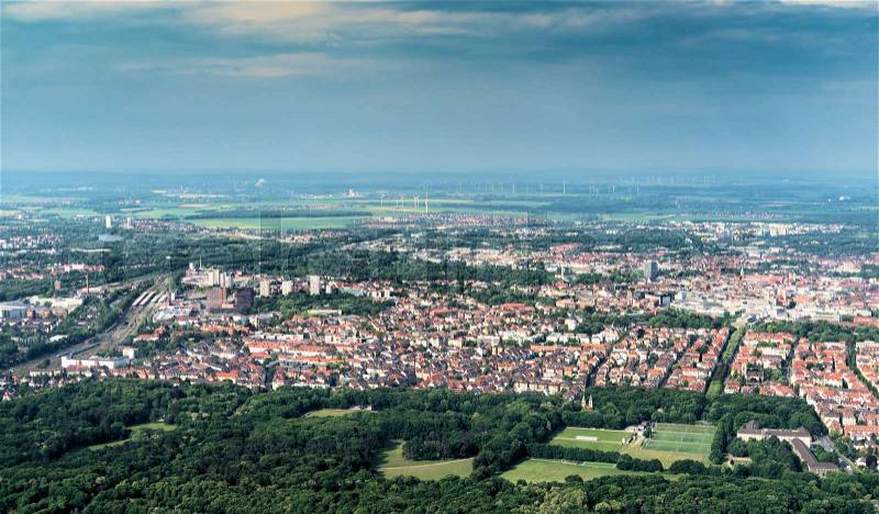 Aerial view of the southern edge of the city of Braunschweig, with parts of the railway station, residential buildings with detached houses, terraced houses and high-rise buildings, stock photo