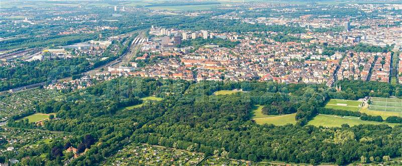 Aerial view of the southern edge of the city of Braunschweig, with parts of the railway station, residential buildings with detached houses, terraced houses and high-rise buildings, stock photo