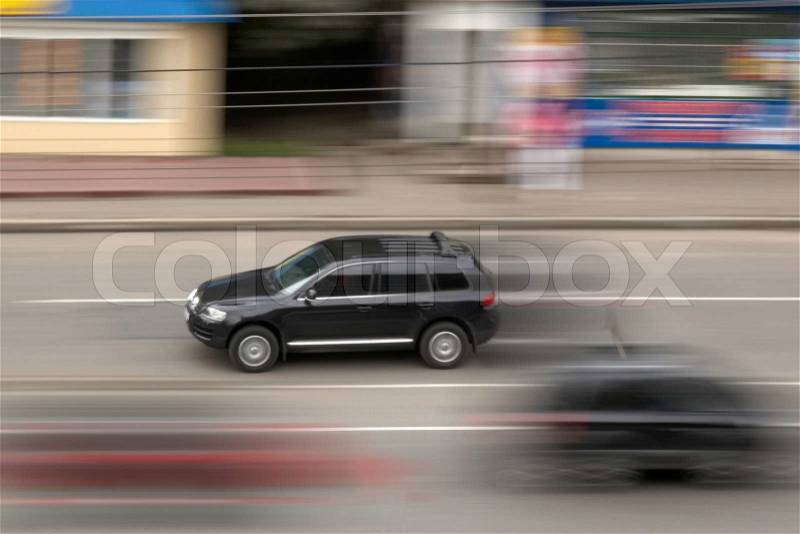 The image of the black car in movement, stock photo