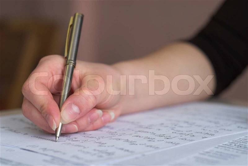 Student is taking test in math, stock photo
