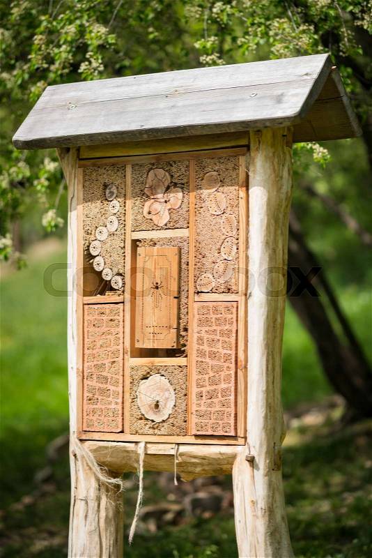 Insect hotel - wooden house made for bugs and solitary insect (bees, wasps,...), stock photo
