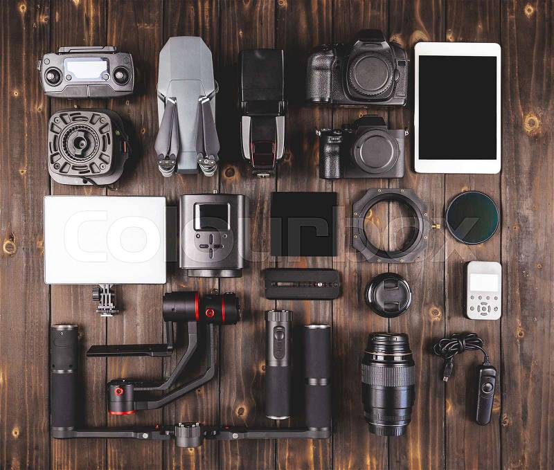 Camera gear on wood top view, stock photo