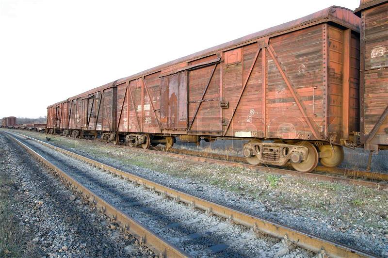 Old rusty train wagons on railway, stock photo