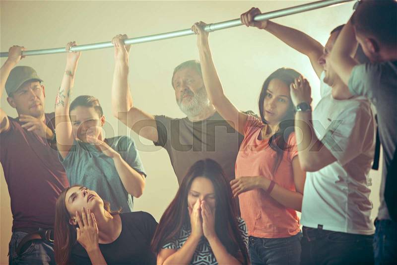 Smell of sweat. Sweaty armpits. Man in bus or public transport. The unhappy people near man. Hyperhidrosis sweat, health social problem. Human emotions concept, stock photo