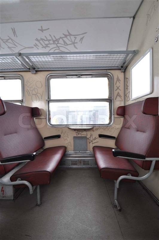 Damaged train interior of empty old train, stock photo