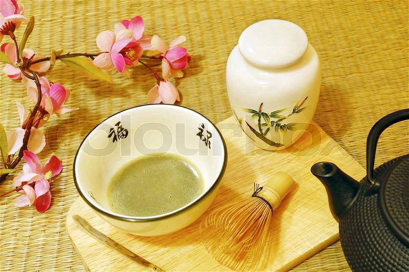Tools used for Japanese tea ceremony chado A brush made of bamboo and a teacup with green tea called matcha on wooden tray, stock photo