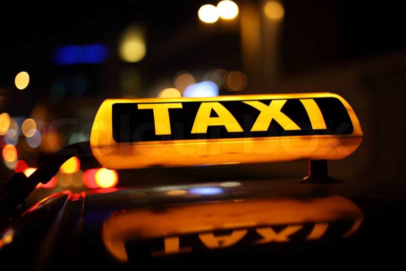 Taxi in the city at night, stock photo