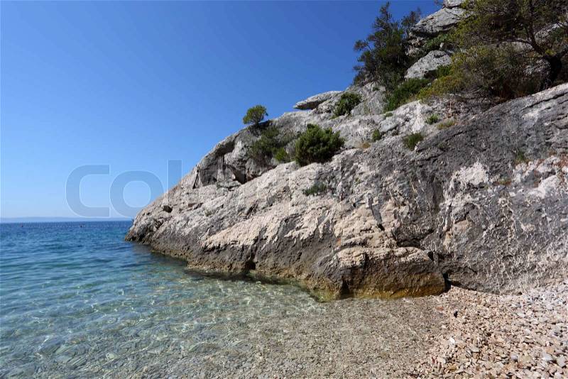 Rock and crystal clear water at the Adriatic coast in Croatia, stock photo