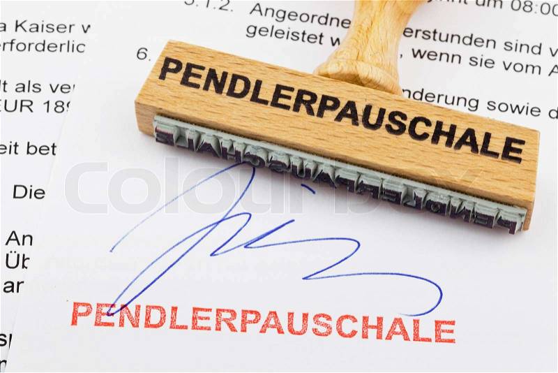 A stamp made of wood lying on a document, stock photo